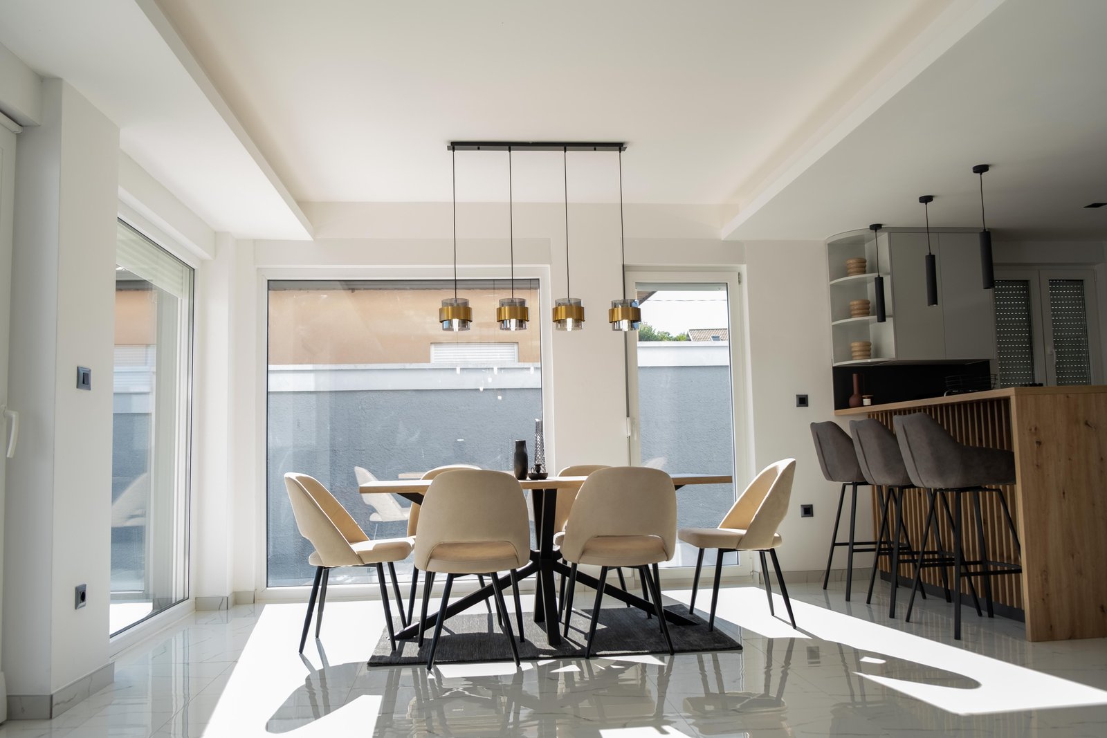Bright dining area with designer table for families and groups at Villa Verona